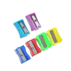 Collection of six colorful plastic manual pencil sharpeners on a clean white background.