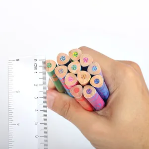 Macro detail of jumbo triangular rainbow colored pencils showing core diameter with a ruler
