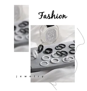 Collection of stylish black and white minimalist ceramic rings with geometric patterns