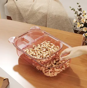 Close-up of pink double-layer bear-shaped snack box showing practical shell storage