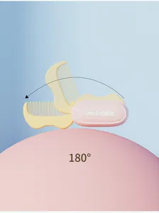 Detailed view of the 180-degree rotatable folding mini hair comb in pink and yellow finish