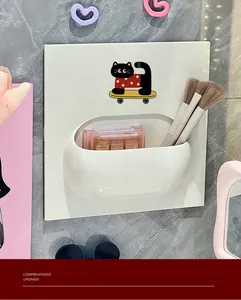 Detail of a wall-mounted cartoon cat storage rack holding makeup brushes and palettes