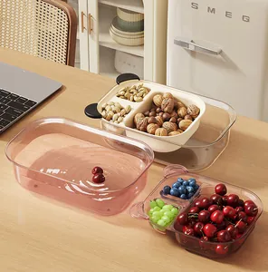 Close-up detail of a double-layered divided food storage box for fresh fruit and nuts