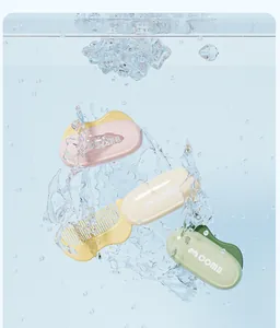 Detail view of colorful waterproof mini foldable travel combs in refreshing water splash