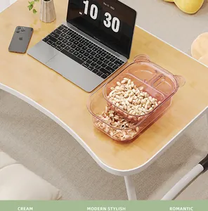 Lifestyle detail of pink bear-shaped double-layer partitioned snack storage box on desk