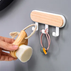 Minimalist pine wood wall hooks with 3 hooks showing facial brush and hair tie