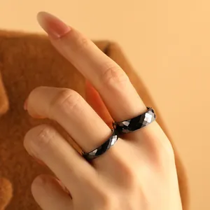 Elegant black faceted ceramic ring with a minimalist rhombus design for women