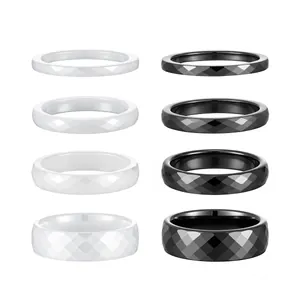 Set of faceted ceramic rings in black and white with different widths and rhombus pattern
