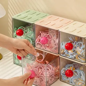 Stackable transparent desktop storage boxes with colorful drawer lids and knobs