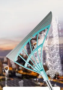 Detailed view of a magic silicone squeegee broom removing soap foam from glass
