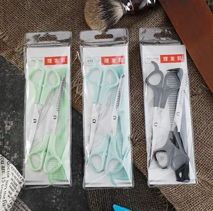Detailed view of three hair cutting scissors sets with combs in various colors