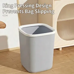 Modern grey plastic trash can with a white press ring for bedroom or living room