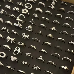 Close-up macro view of assorted 925 sterling silver rings collection on display tray