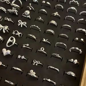 Selection of 925 sterling silver minimalist adjustable rings displayed in a tray