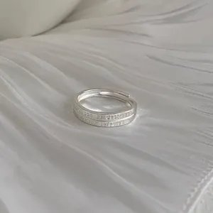 Close-up of minimalist 925 sterling silver open ring with engraved inspirational text