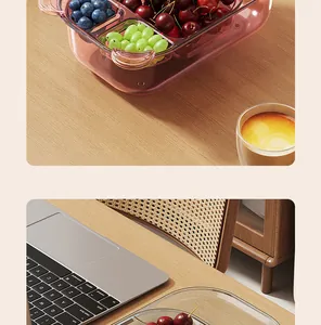 Lifestyle detail of a divided food storage container with fresh berries and grapes