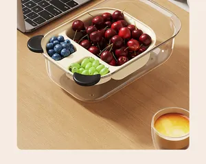 Double-layer divided food storage box with fresh fruit in a lifestyle setting