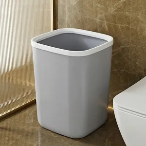 Minimalist large grey plastic open-top waste bin with white rim for bathroom use