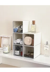 Detail of stackable white acrylic drawer storage boxes for desktop organization