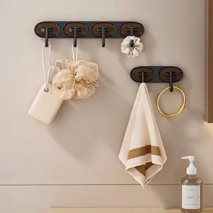 Elegant wall-mounted oval hooks with black frame and walnut wood grain finish for bathroom