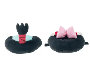 Detailed view of two pet plush hats with samurai topknot and pink bow designs.