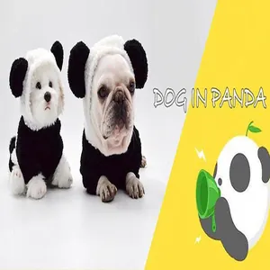 Close-up detail of two dogs wearing cute panda themed pet costumes for Halloween and winter