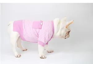 Pink tweed dog sweater featuring luxury knit design on a white French Bulldog model