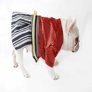Side view of a French Bulldog wearing a red Japanese samurai kimono dog outfit style