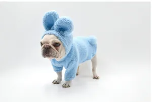 Close-up detail of a French Bulldog wearing a soft blue fleece rabbit-ear pet hoodie for winter