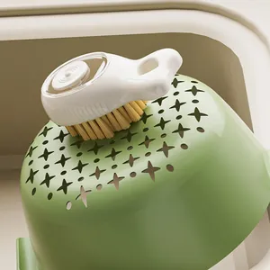 Multi-functional liquid dispensing cleaning brush with soft bristles and ergonomic grip