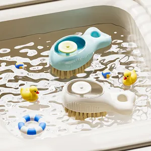 Multifunctional whale-shaped cleaning brush with automatic soap dispenser and soft bristles