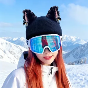 Cute furry cat ears decoration for ski helmets worn by a model in snow mountains