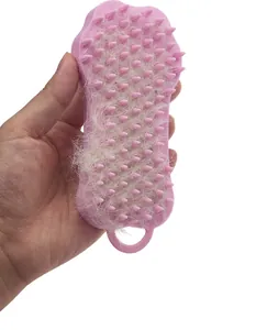 Ergonomic pink silicone pet hair removal brush demonstrating effective grooming for dogs.