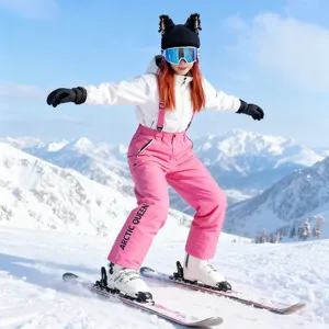 Cute black knitted cat ear beanie decoration for ski helmets on a snowy mountain background