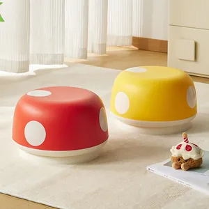 Creative and cute mushroom-shaped low stools in red and yellow for children's rooms.