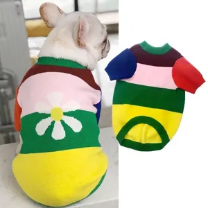 Vibrant multi-colored striped dog sweater featuring a white flower knit pattern.