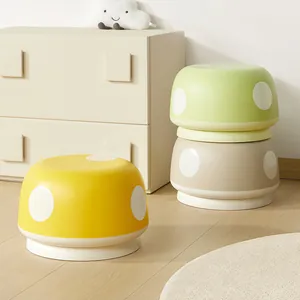 Creative mushroom-shaped low stools in yellow and green for kids' room or entryway