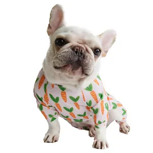 Cute French Bulldog wearing soft pink pet pajamas featuring a playful carrot print pattern