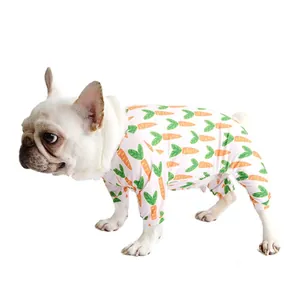 French Bulldog wearing cute pink pajamas with carrot print, isolated on a white background