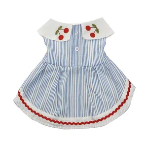 Blue and white striped dog dress with cherry embroidery and red wavy trim details