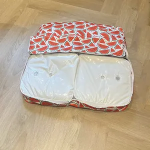 Detailed view showing the dual fill valves of a watermelon patterned pet cooling water bed.