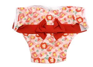 Detailed view of a pink floral pet kimono featuring a large red decorative bow on the back