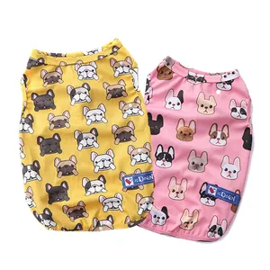 Two breathable dog cooling vests with cartoon French Bulldog patterns in yellow and pink