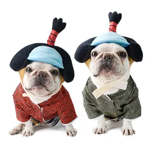 French Bulldogs in traditional Japanese samurai dog costumes with matching hats