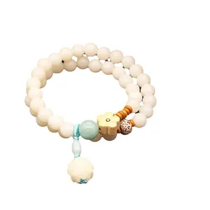Bracelet à double rang en graines de bodhi blanches avec pendentif lotus et fleur