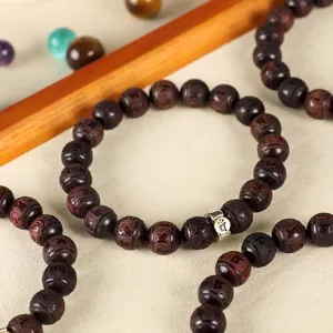Vintage small-leaf red sandalwood beaded bracelet with intricately carved Buddhist mantras