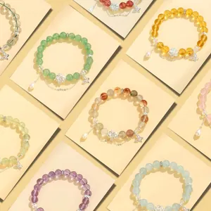 Elegante collezione di braccialetti con perline di cristallo, ciondoli loto e perle