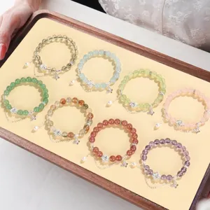 Eleganti bracciali di perline con ciondoli a loto e perle d'acqua dolce