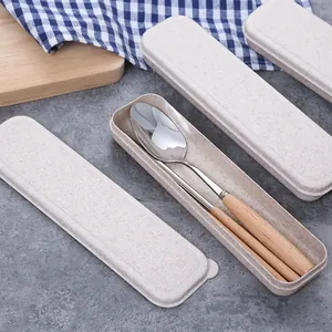 Portable stainless steel cutlery set with wooden handles and storage box