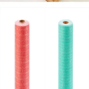 Close-up detail of wavy pattern on colorful disposable non-woven cleaning dishcloth rolls